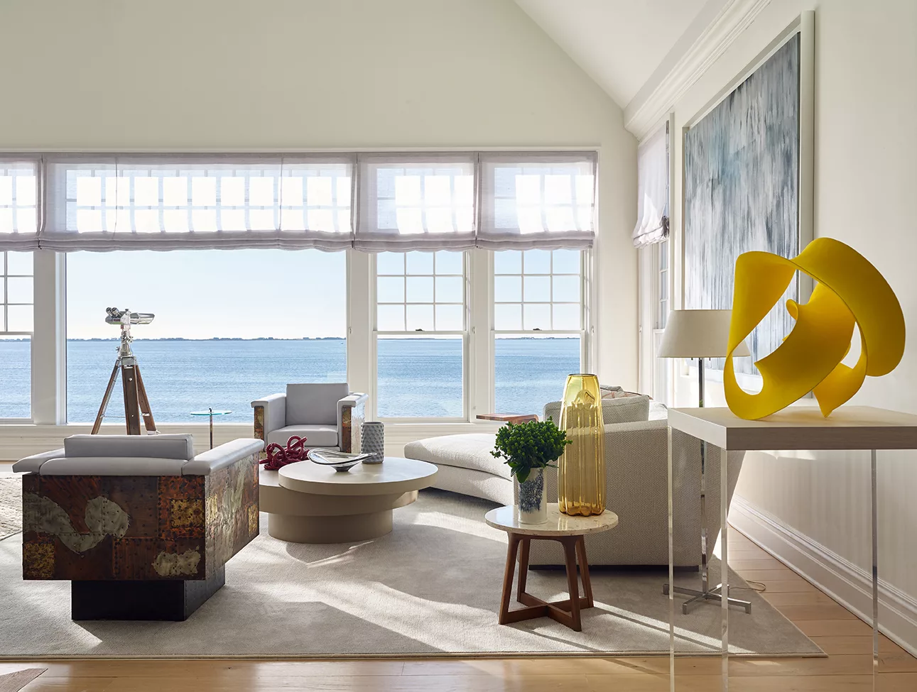 Waterfront Estate | Livingroom with White Cozy Furniture and Big Windows with Views of the Water