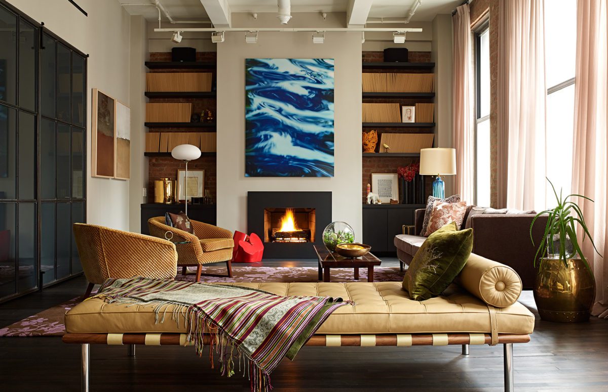 Iacono Residence | Cozy livingroom With Comfortable Furniture in Brown Tones and a Fireplace at the Bottom