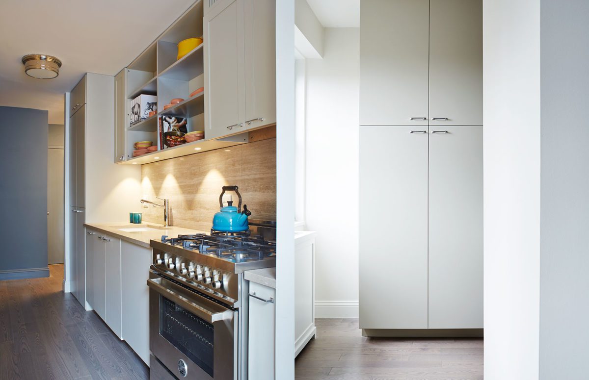View of a Kitchen and Tall White Kitchen Cupboard