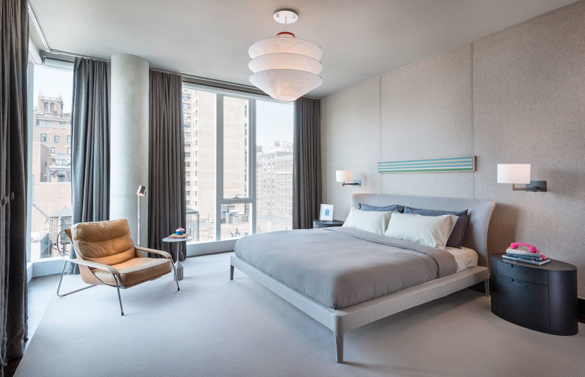 Bedroom with Grey Interior Design, a chair by big windows with views of the city