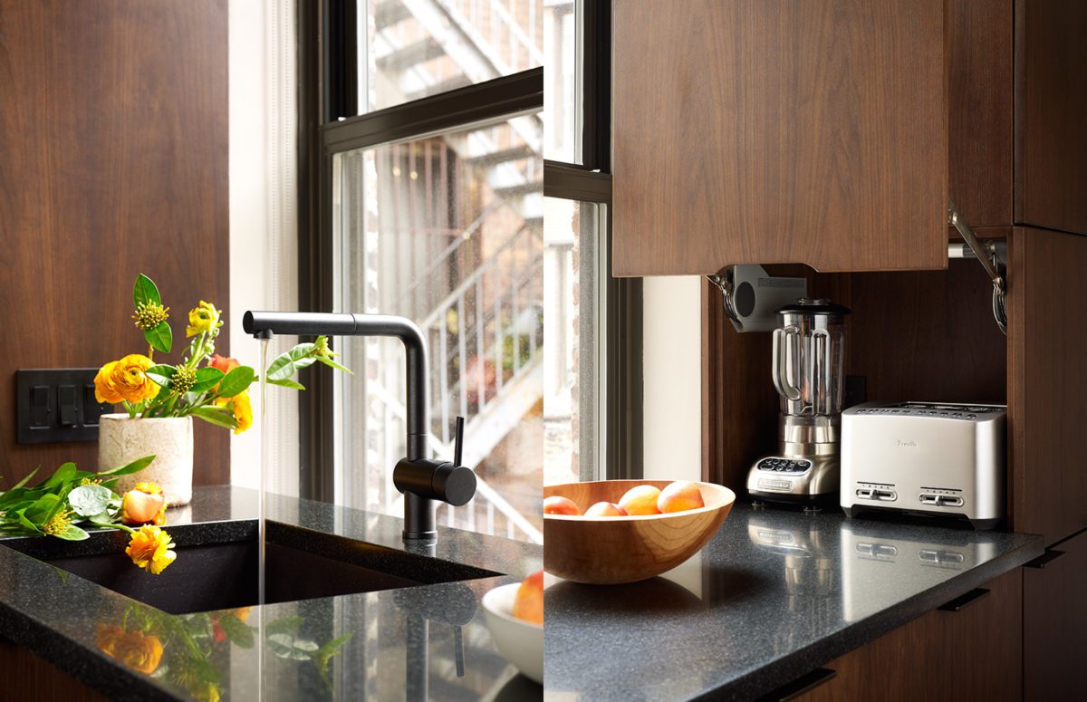 Water Pouring Our of a Sink, a blender and a toaster on the kitchen countertop