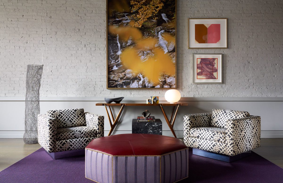 Living Room With Two White and Black Armchairs and Purple Rug