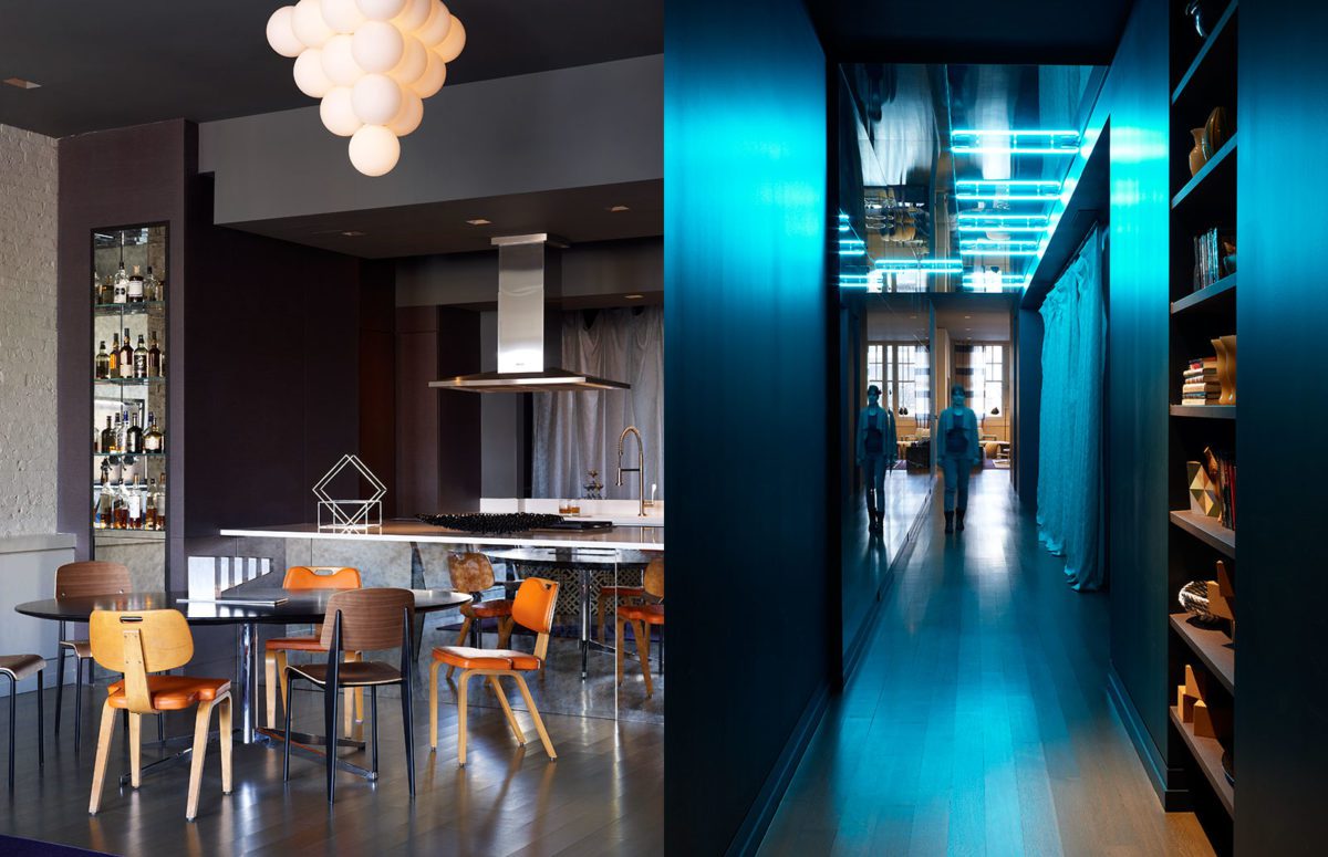 Black kitchen and dining room and a Hallway lit up with blue overhead lights