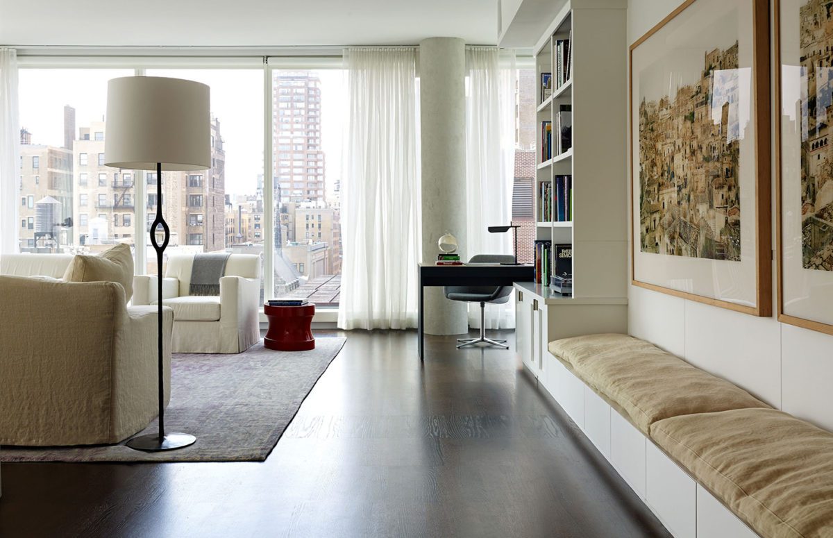 Spacious Living Room with a Seating Area next to Large Window with City View