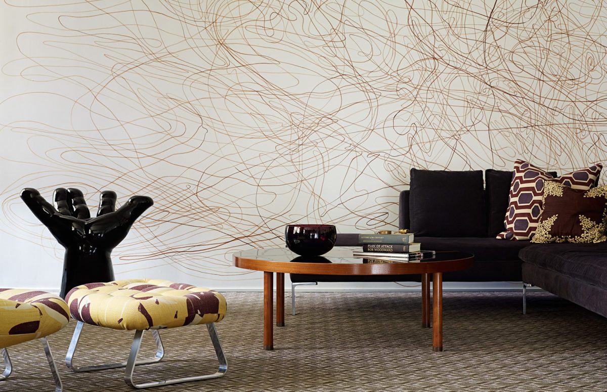 Living Room with Cozy Seating Area and A Black Open Hand Statue