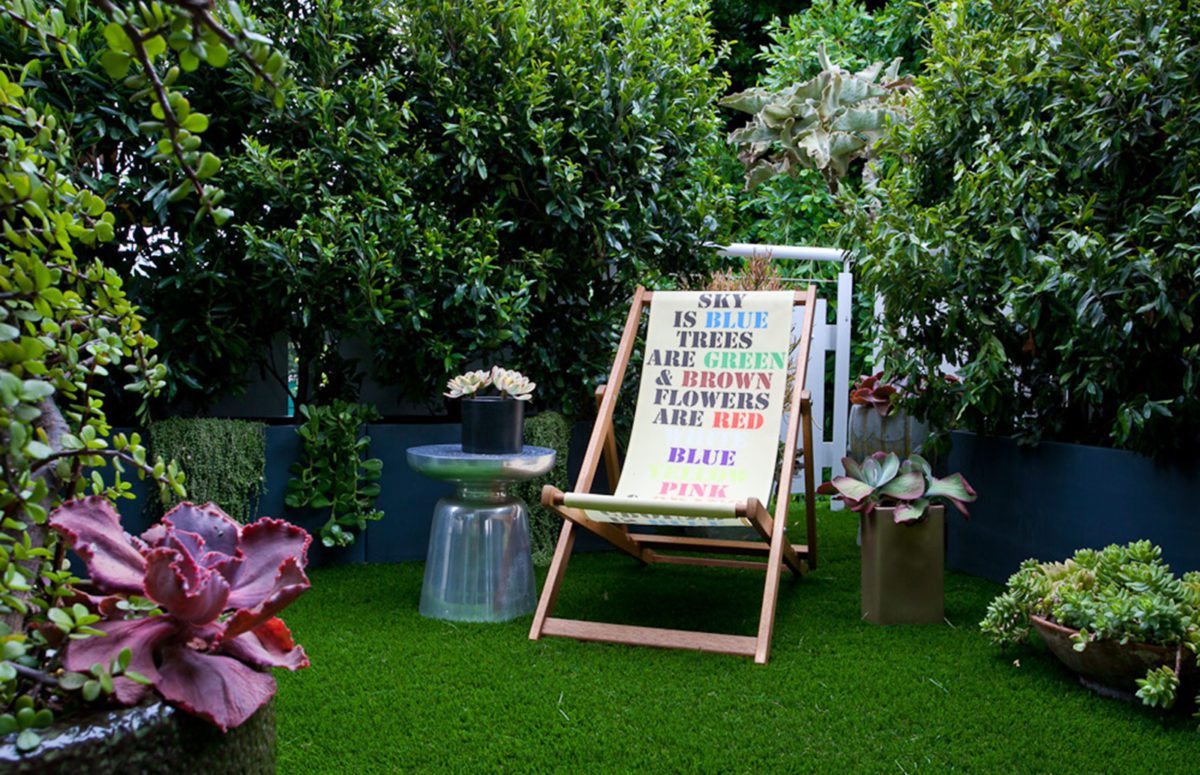 Venice loft outdoor grass lawn and a folding textile chair with printed colorful text