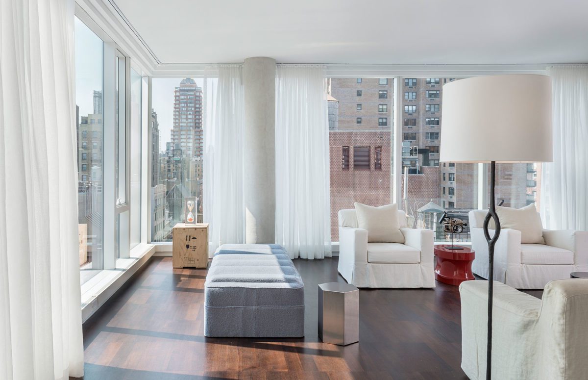 Living Room with White Furniture, A White Lamp and Views of the City