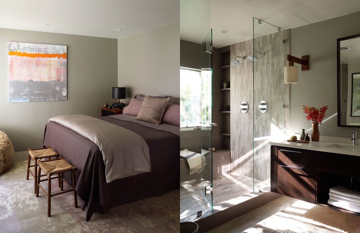 Bedroom with a big bed and two footstools, and bathroom with glass door
