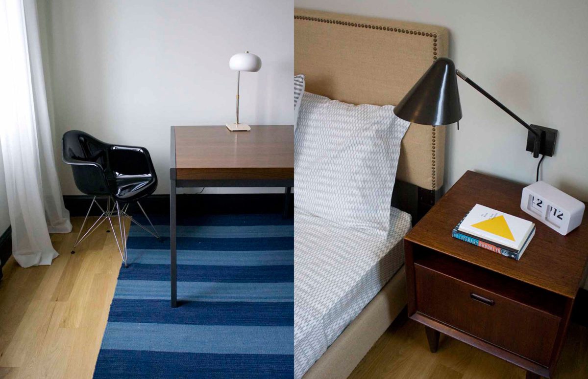 Desk setup and lamp on a nightstand by the bed