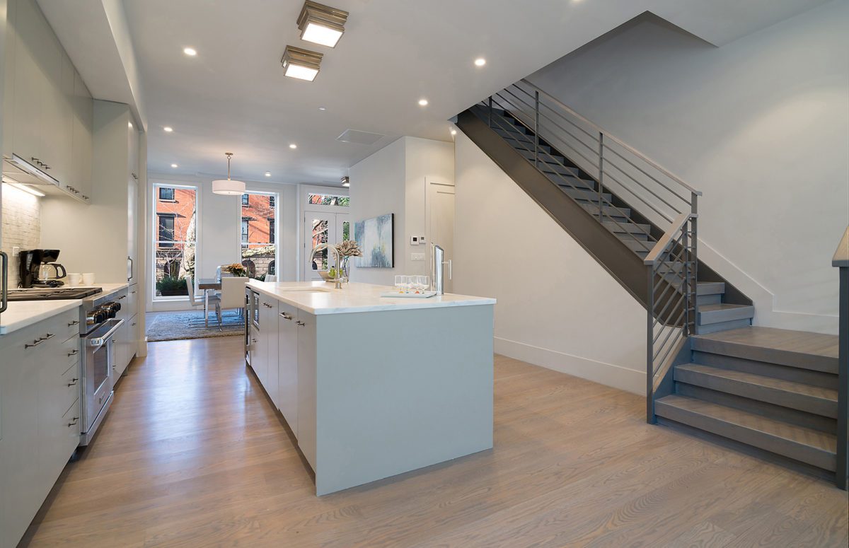 Spacious Kitchen with White Interior Design and Grey Straight Stairs