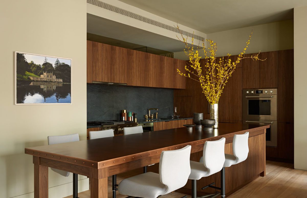 Kitchen with Wooden Cupboard and a Large Rectangle Wooden Table