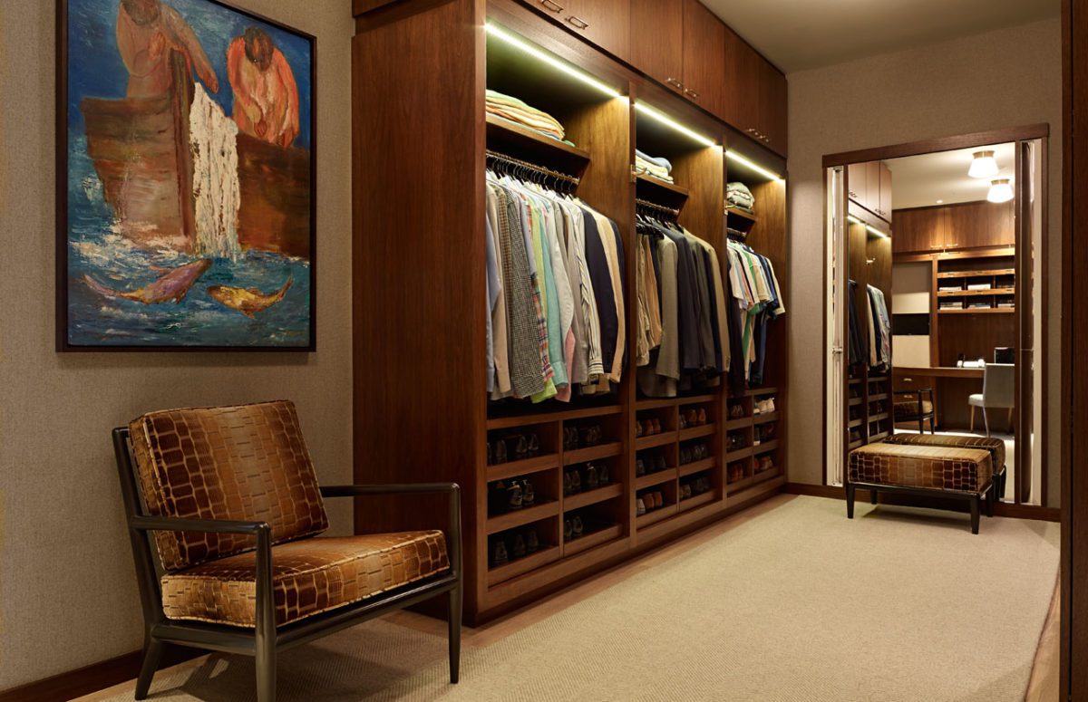 Big Wooden Wardrobe with lighting, Comfortable Chair in Brown Shades, and Full-Length Mirror