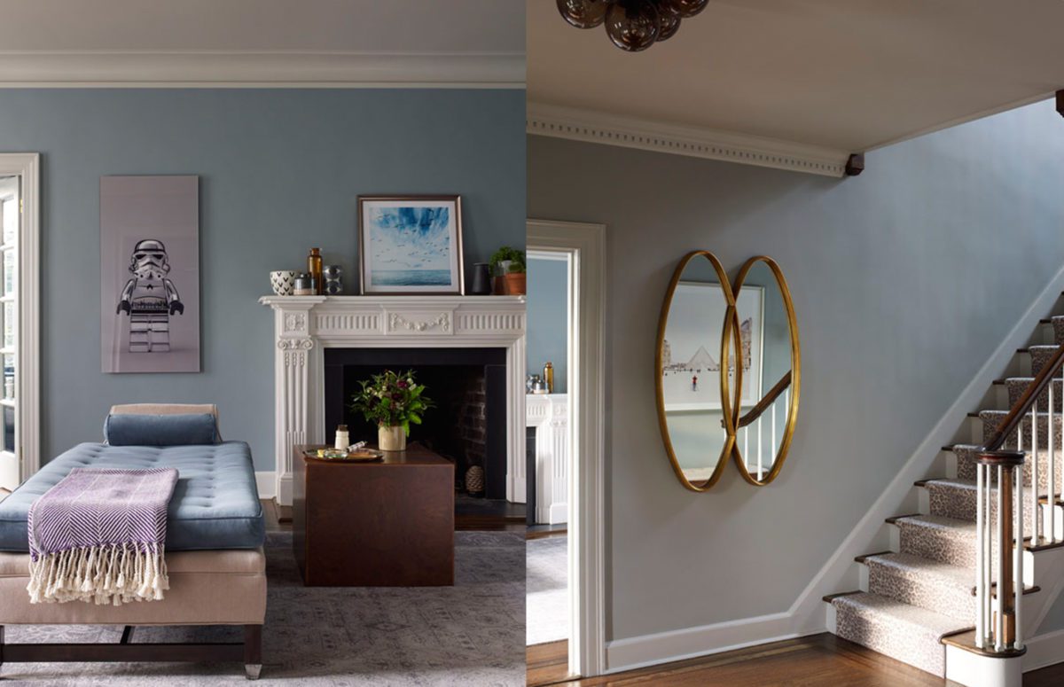 A Bed Next to a White Fireplace and a View of a Mirror next to a Straight Staircase