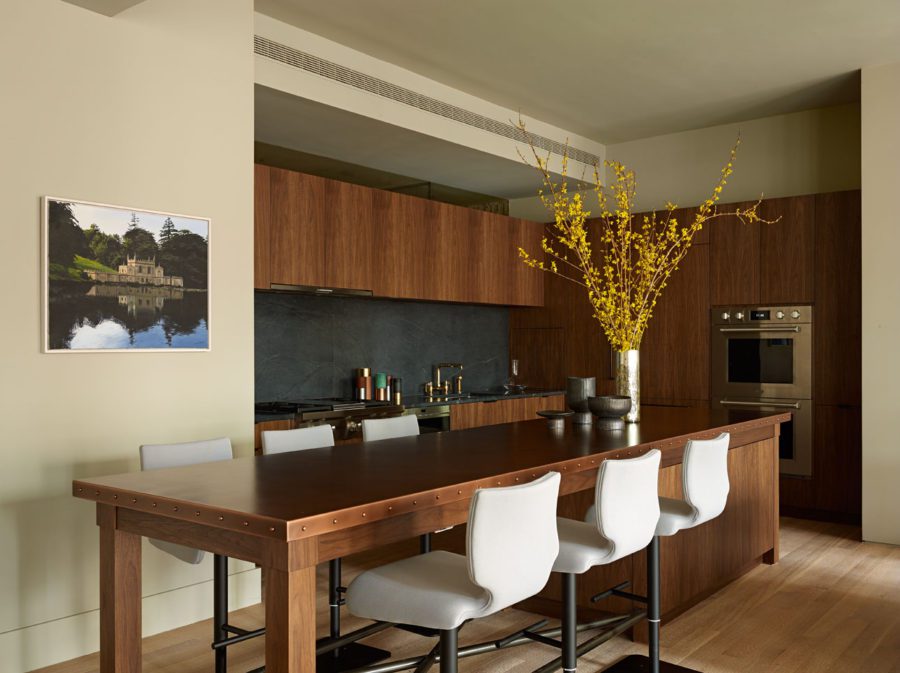 Kitchen with Wooden Cupboard and a Large Rectangle Wooden Table