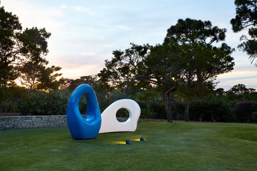 Outdoor view of lawn with decorative blue and white pieces