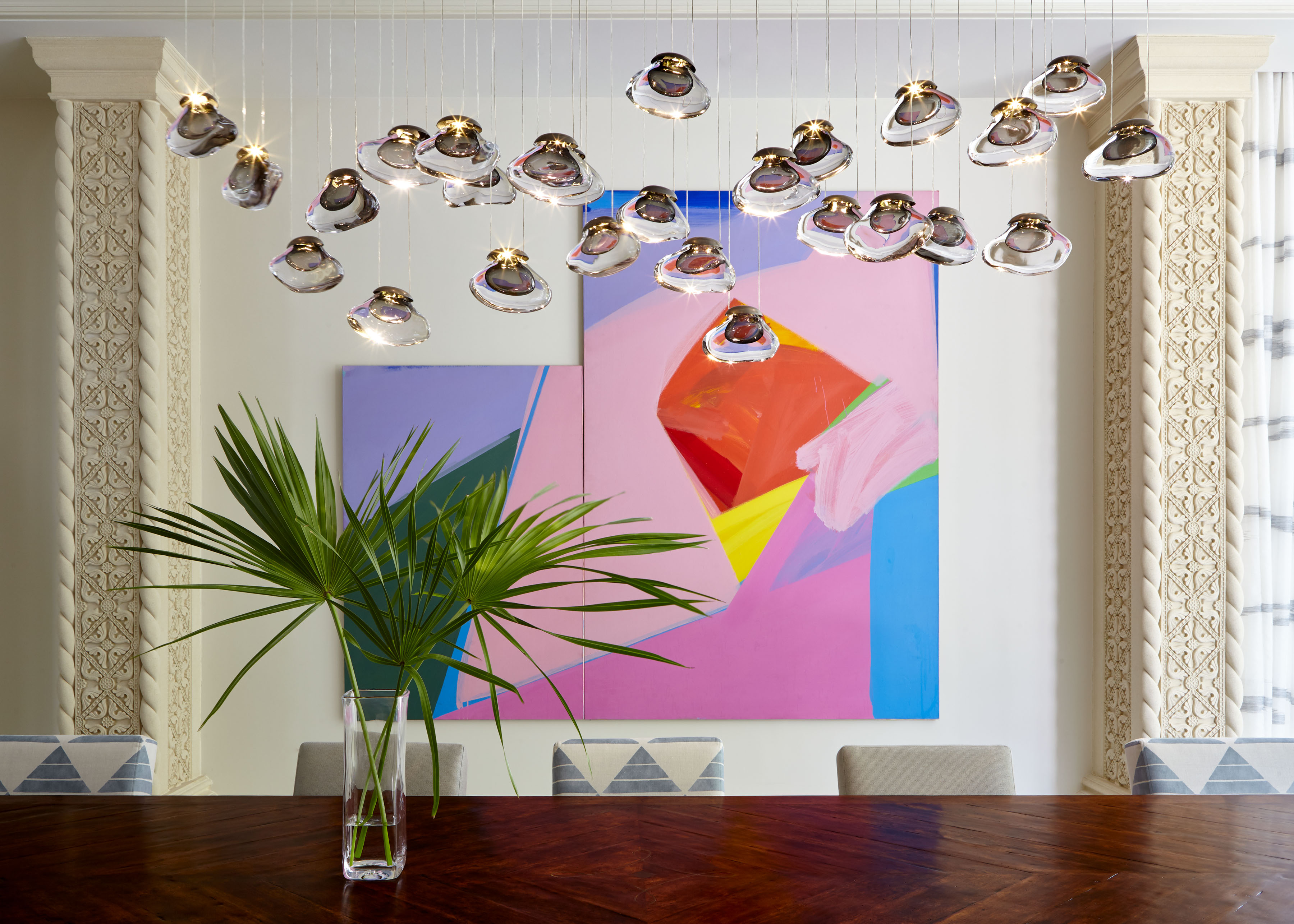 Hanging Crystal Lampshades, A Tropical Plant and Painting in Predominantly Cool Colors
