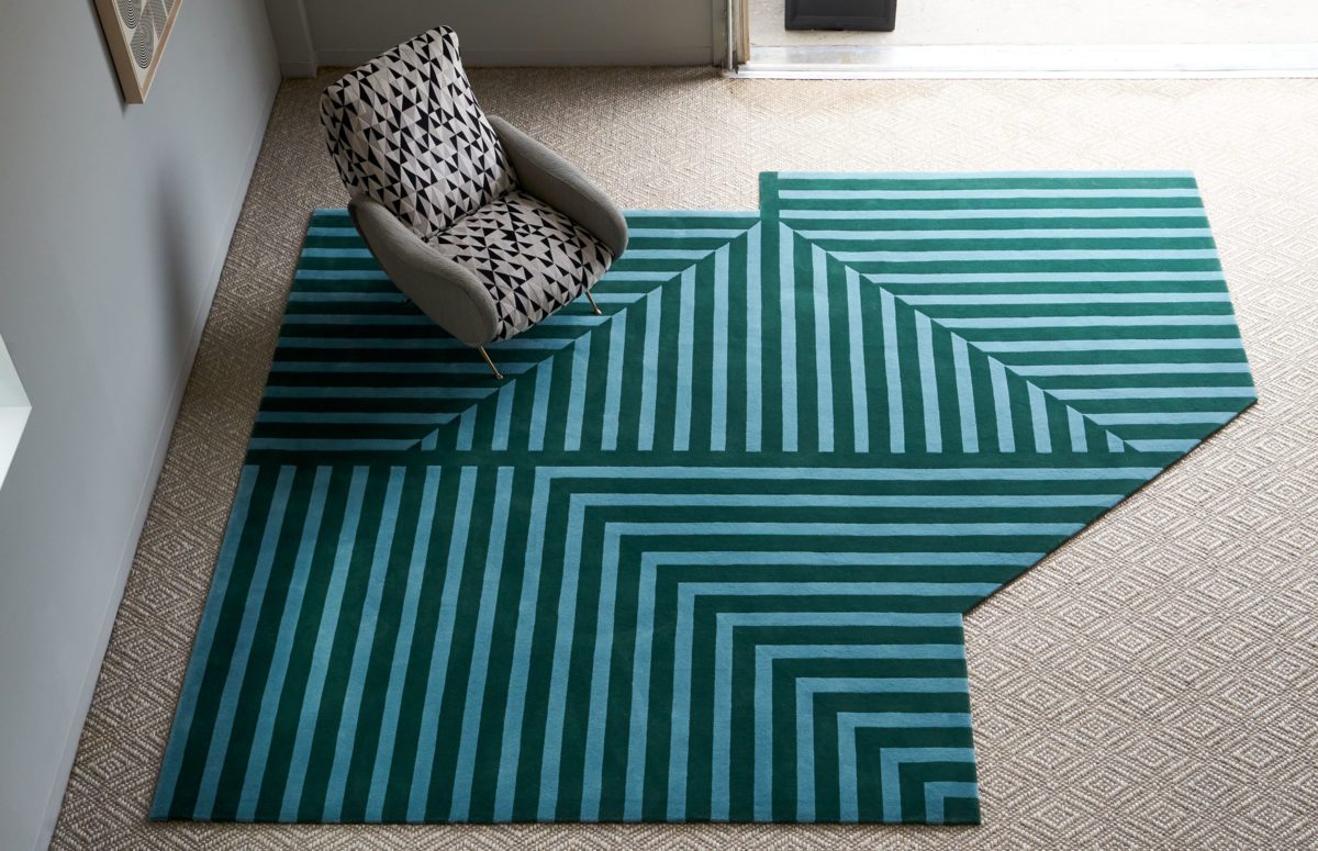 Top View of A Modern Blue Greek Rug and an Armchair from the F Collection