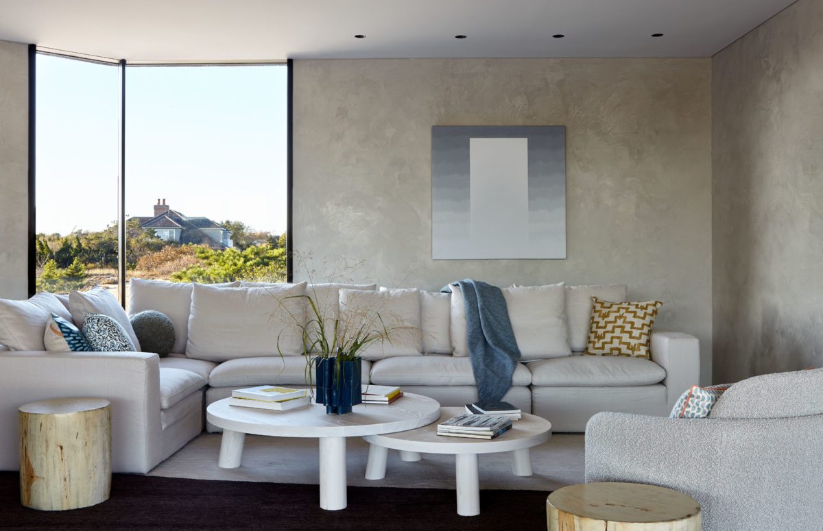 Living Room with White Interior Design, A Big Cozy Tux Sofa and Views of the Nature