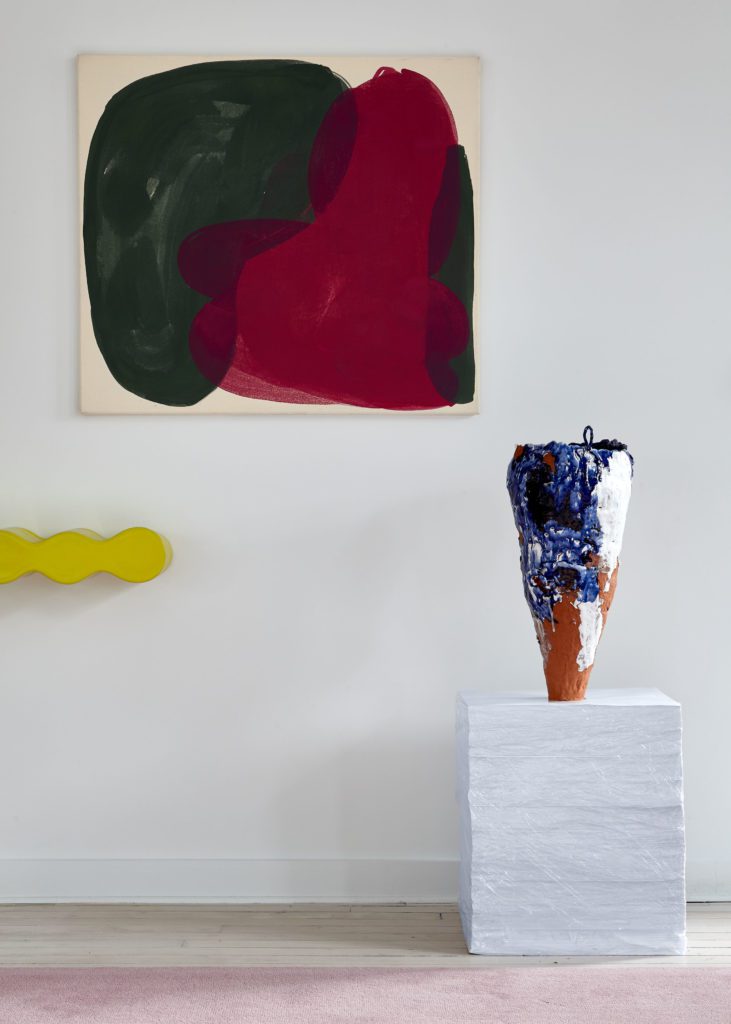 Penthouse | Fall ’19 | Tricolored Abstract Painting and A Conical Sculpture on a White Table
