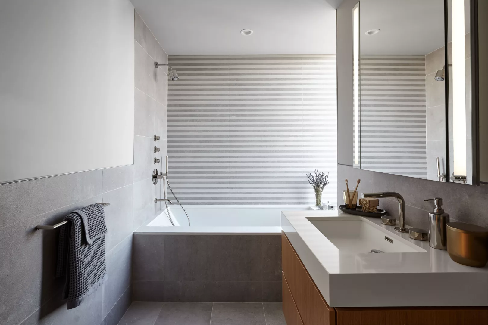 Bathroom with A Light Grey Interior Design and Wide Bathtub