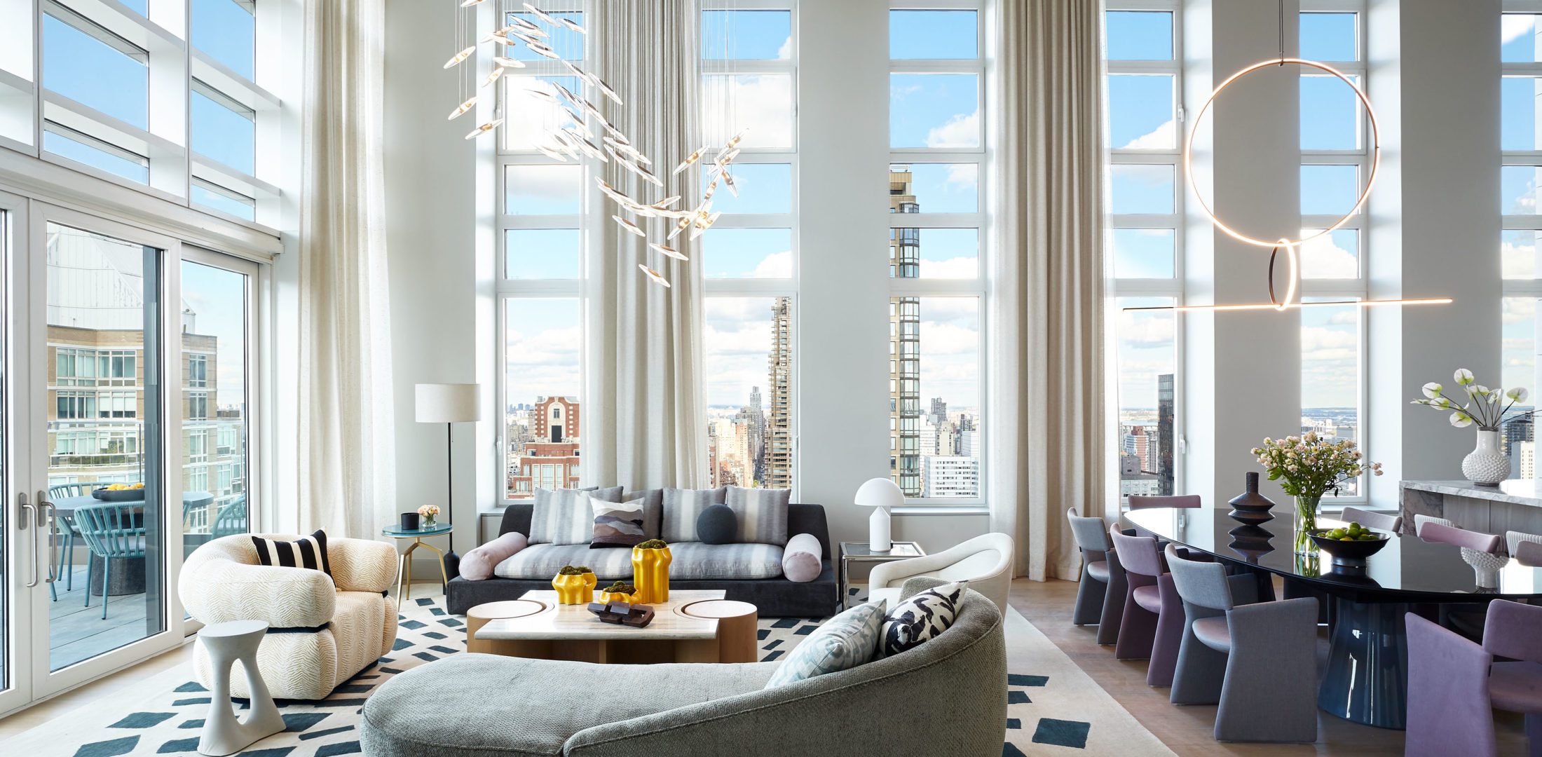 The Leyton Penthouse | Light Living room with Cozy Sitting and Dining Areas and Beautiful Views of the City
