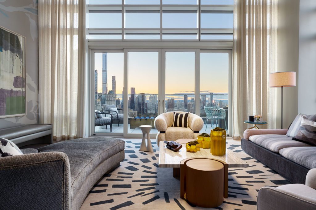Spacious Living Room With White and Grey Interior Design and Impressive View of the City