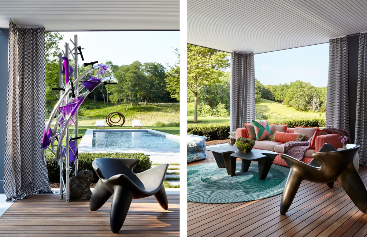 Outdoor terrace with views of a water pool, sculptural chairs, an orange sofa and a table