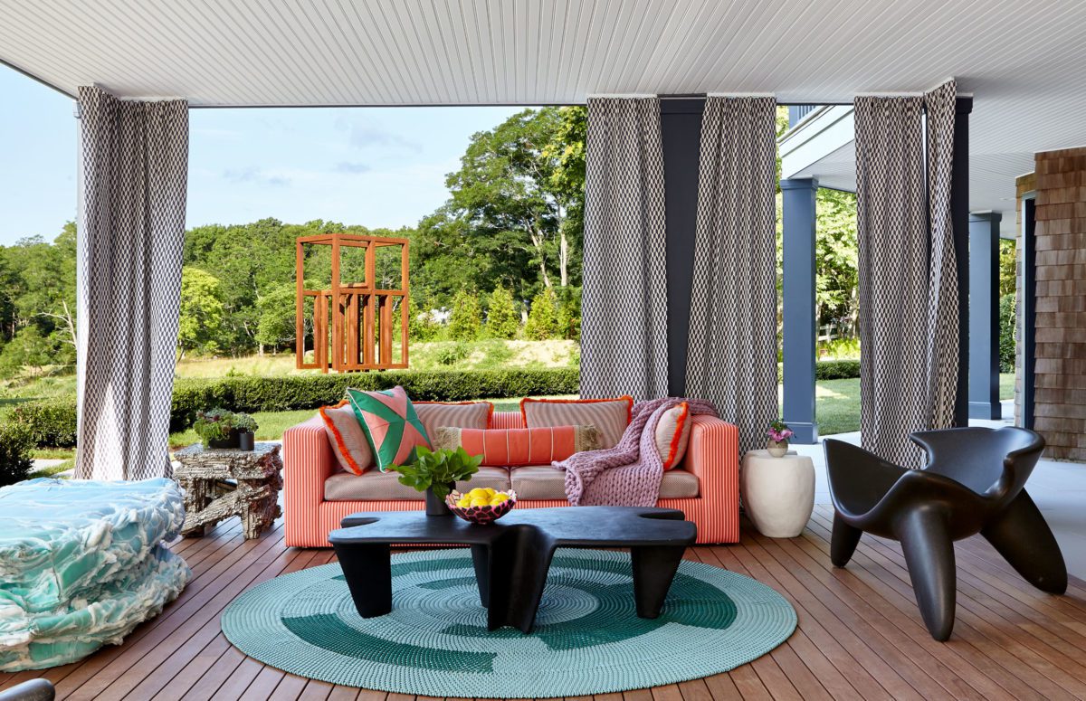 Galerie House of Art and Design | Sunset Terrace in the Garden with Cozy Orange Sofa and Sculptural Chairs