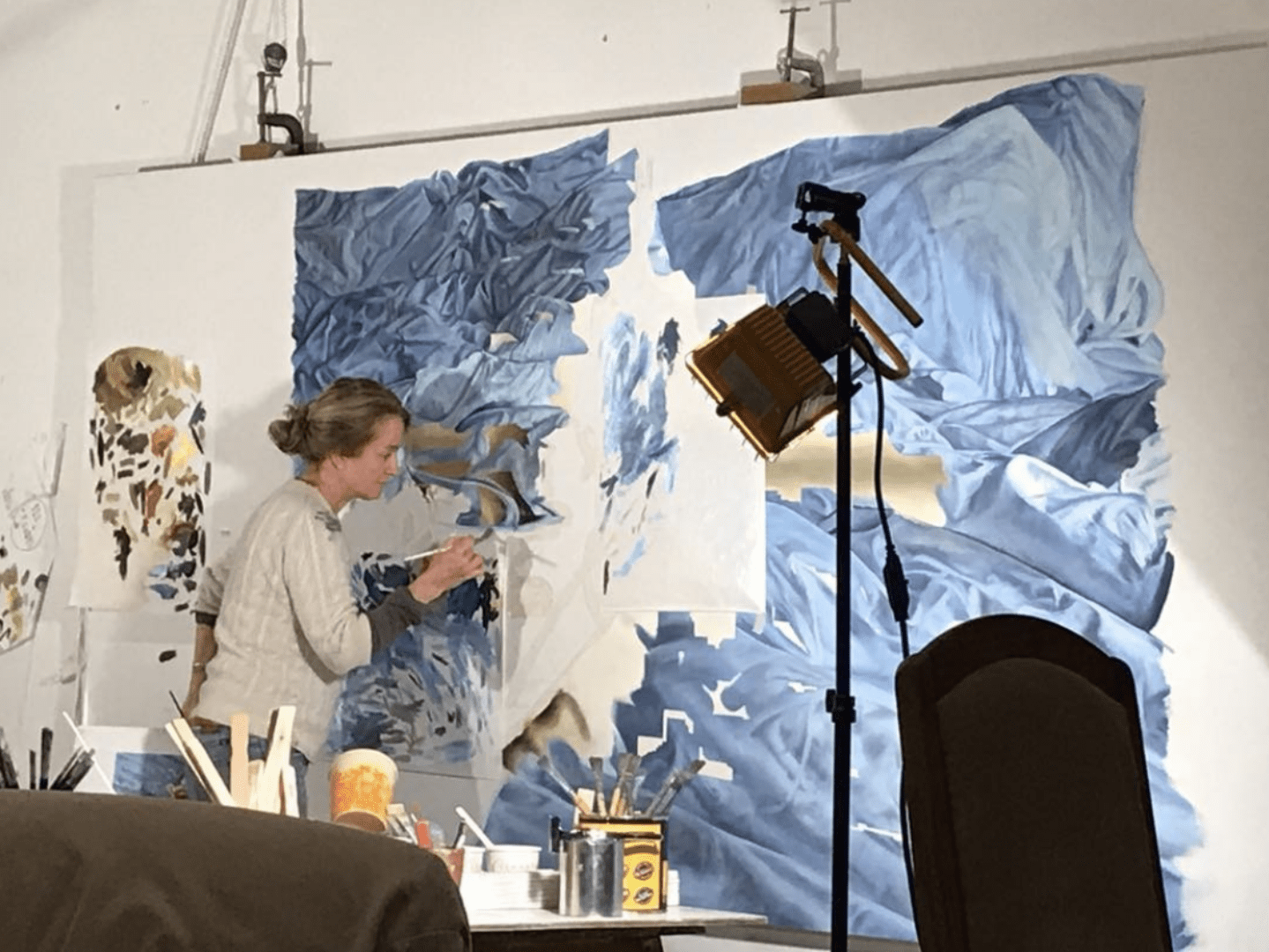 Artist Christine Keefe painting in her studio